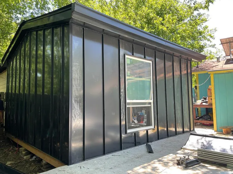 Black standing seam metal wall panels for Roof Inspection in Fort Worth
