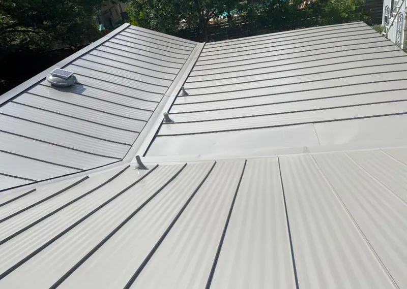 Solar attic fan installed on a metal roof for Roof Ventilation in Fort Worth