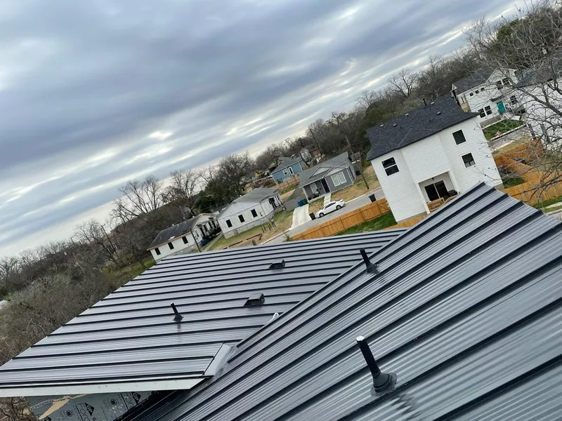 Standing seam metal roof panels with vents for Skylight Repair in Fort Worth